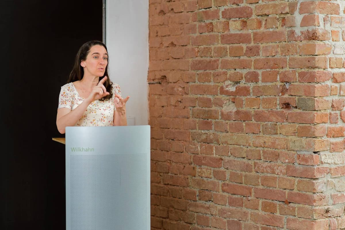 Elizabeth C. Miller speaking on stage